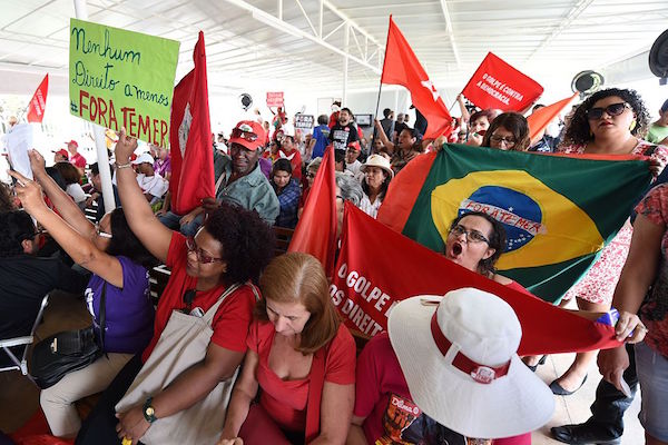 Supporters of Brazilian suspended President Dilma Rousseff follow the Senate's session as it votes on stripping her of the presidency in a traumatic impeachment trial, on a screen at Planalto Palace in Brasilia on August 31, 2016. Rousseff, from the leftist Workers' Party, is accused of taking illegal state loans to patch budget holes in 2014, masking the country's problems as it slid into its deepest recession in decades. / AFP / EVARISTO SA (Photo credit should read EVARISTO SA/AFP/Getty Images)