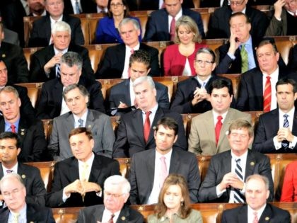 Republican members of Congress listen during President Baracl Obama's State of the Un