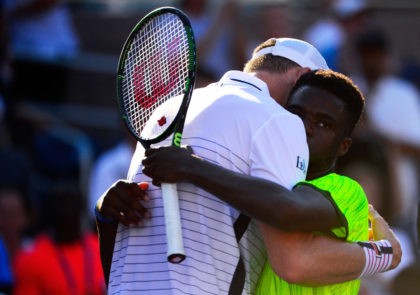 NEW YORK, NY - AUGUST 29: John Isner and Frances Tiafoe of the United States embrace afte