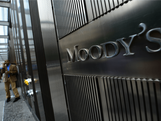 A sign for Moody's rating agency is displayed at the company headquarters in New York