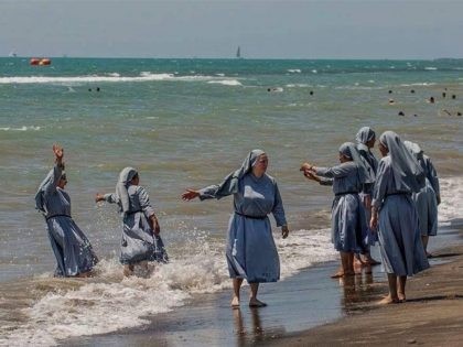Nuns on beach
