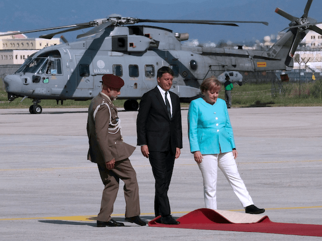 Italian Prime Minister Matteo Renzi (C), German Chancellor Angela Merkel