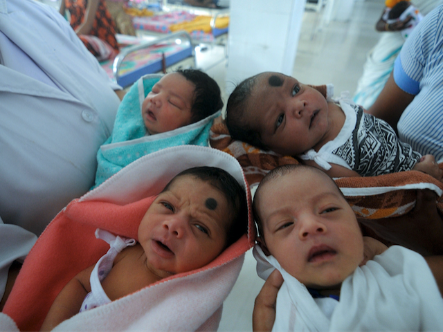 Indian nurses care for newly born babies at the maternity ward of a hospital on the eve of World Population Day, in Guwahati on July 10, 2014. World Population Day, which was established by the United Nations Development Programme in 1989 and is observed annually, seeks to raise awareness of …
