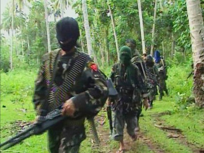 Abu Sayyaf rebels are seen in the Philippines in this video grab made available February 6, 2009. REUTERS/Philippine National Red Cross via Reuters TV