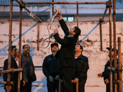 Iranian officials prepare the noose for the execution of Balal, who killed fellow Iranian youth Abdolah Hosseinzadeh in a street fight with a knife in 2007, during his execution ceremony in the northern city of Noor on April 15, 2014. Samereh Alinejad, the mother of Abdolah Hosseinzadeh, spared the life …