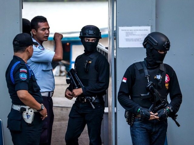 CILACAP, CENTRAL JAVA, INDONESIA - JULY 27: Indonesian police walk as guard at Wijayapura