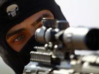 A fighter from the Iraqi Imam Ali Brigade, take part in a training exercise in Iraq's central city of Najaf on March 7, 2015, ahead of joining the military operation in the city of Tikrit. Some 30,000 Iraqi security forces members and allied fighters launched an operation to retake Tikrit …