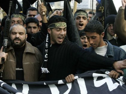 Supporters of the Islamic Jihad movement shout slogans during a demonstrations against the