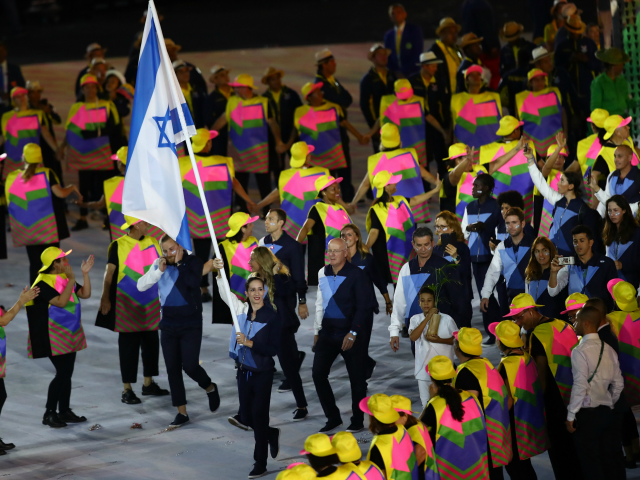 RIO DE JANEIRO, BRAZIL - AUGUST 05: Neta Rivkin of Israel carries the flag during the Open