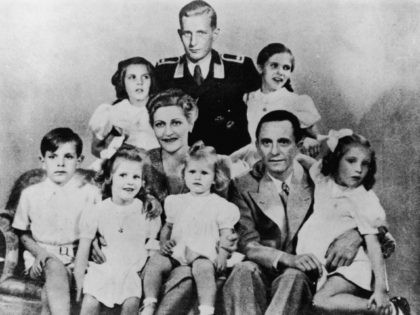 German Nazi politician and minister of propaganda Paul Joseph Goebbels (1897 - 1945) with his wife Magda and their children, Helga, Hildegard, Helmut, Hedwig, Holdine and Heidrun, 1942. Also present is Harald Quandt (in uniform), Magda Goebbels' son by her first marriage. With the fall of the Third Reich, Magda …