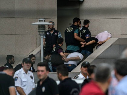 Detained Turkish soldiers who allegedly took part in a military coup arrive with their hands bound behind their backs at the Istanbul Justice Palace (Adalet Sarayi) on July 20, 2016, following the failed military coup attempt of July 15. Turkish President Recep Tayyip Erdogan on July 20 chaired a crunch …