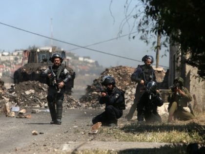 Israeli security forces aim at Palestinian protesters during clashes following a demonstration against the expropriation of Palestinian land by Israel on April 29, 2016 in the village of Kfar Qaddum, near Nablus, in the occupied West Bank. / AFP / JAAFAR ASHTIYEH (Photo credit should read JAAFAR ASHTIYEH/AFP/Getty Images)