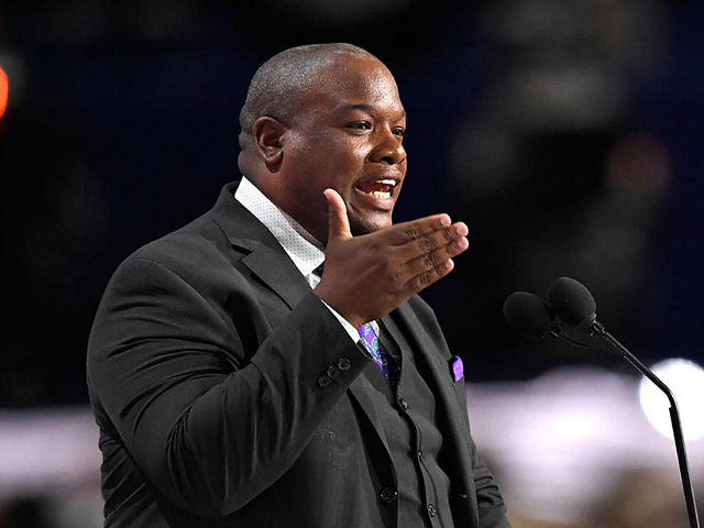 Pastor Mark Burns delivers the benediction at the close of the afternoon session during th