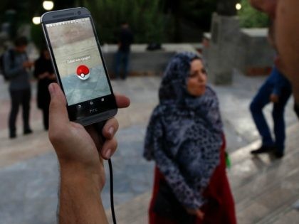 An Iranian man plays on the Pokemon Go app in northern Tehran's Mellat Park on August 3, 2016. / AFP / ATTA KENARE (Photo credit should read ATTA KENARE/AFP/Getty Images)