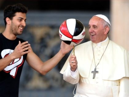 Pope Francis plays with a basketball during the Italian Catholic Sports Centre (CSI) 70th