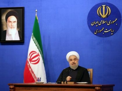 Iranian President Hassan Rouhani speaks during a press conference next to a frame bearing a portrait of the late founder of the Islamic Republic, Ayatollah Ruhollah Khomeini, on March 6, 2016 in the capital Tehran. Rouhani promised that 2016 will be a better year, weeks after Tehran's nuclear deal took …