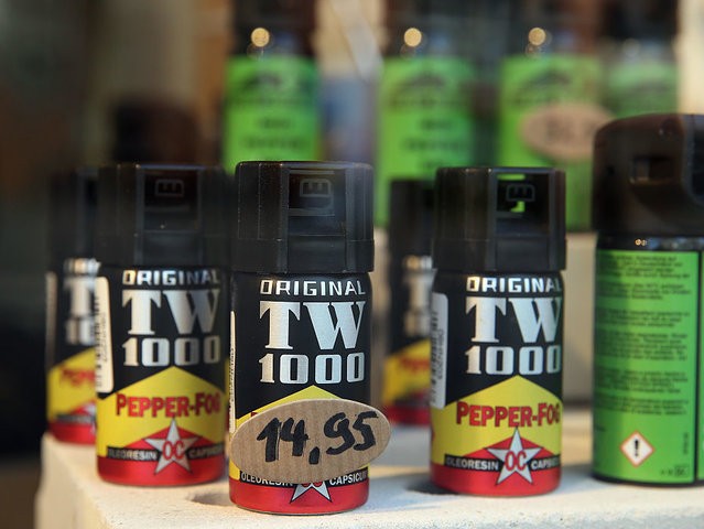 BREMEN, GERMANY - FEBRUARY 25: Cans of pepper spray stand on display in the shop window o