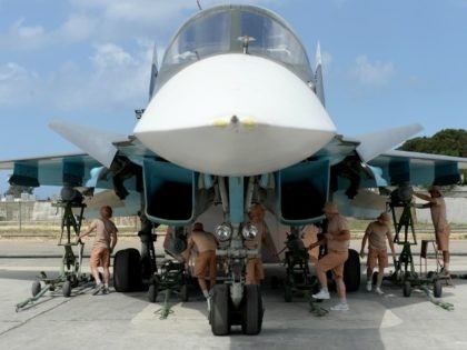 Russian servicemen prepare an SU-34 fighter jet for a mission from the Russian Hmeimim military base in Latakia province, in the northwest of Syria on May 4, 2016. Syria's conflict erupted in 2011 after anti-government protests were put down. Fighting quickly escalated into a multi-faceted war that has killed more …