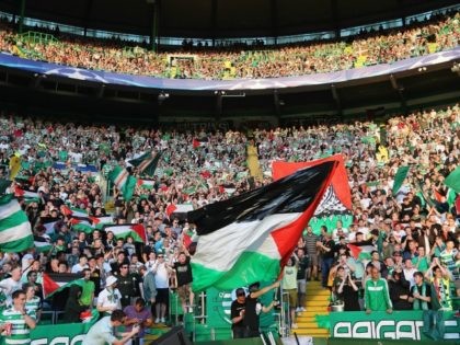 GLASGOW, SCOTLAND - AUGUST 17: The Palestinian flag is waved by fans during the UEFA Champions League Play-off First leg match between Celtic and Hapoel Beer-Sheva at Celtic Park on August 17, 2016 in Glasgow, Scotland. (Photo by Steve Welsh/Getty Images)