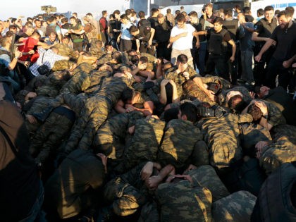 Surrendered Turkish soldiers who were involved in the coup are surrounded by people on Bos