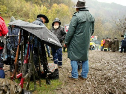 Participants use an umbrella to protect their infantry and assault …