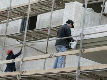 Thai laborers work in the construction of new house units in the Maaleh Hazeitim settlement, in the Ras al-Amud area of mostly arab east Jerusalem, on December 29, 2009. Israel has invited tenders for the building of hundreds of more homes in Jewish settlements in annexed Arab east Jerusalem, the …