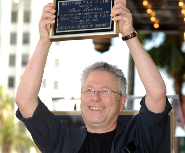 Composer Alan Menken poses after being honored with a Star on the Hollywood Walk of Fame i