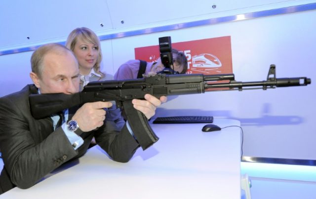 Russia's Vladimir Putin, seen handling a replica Kalashnikov assault rifle at a shooting g