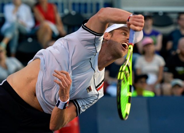 Sam Querrey of the US serves to Guillermo Grcia-Lopez of Spain during their ATP Winston-Sa