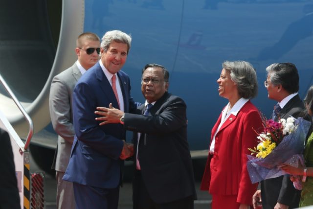 US Secretary of State John Kerry (L) is welcomed by Bangladesh counterpart Mahmood Ali as