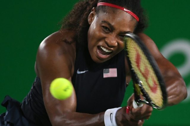 Serena Williams of the US hits a return to France's Alize Cornet during their second round