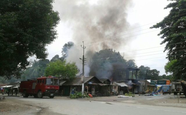 Smoke rises from the site of a militant attack at Balajan Tinali, in the Kokrajhar distric