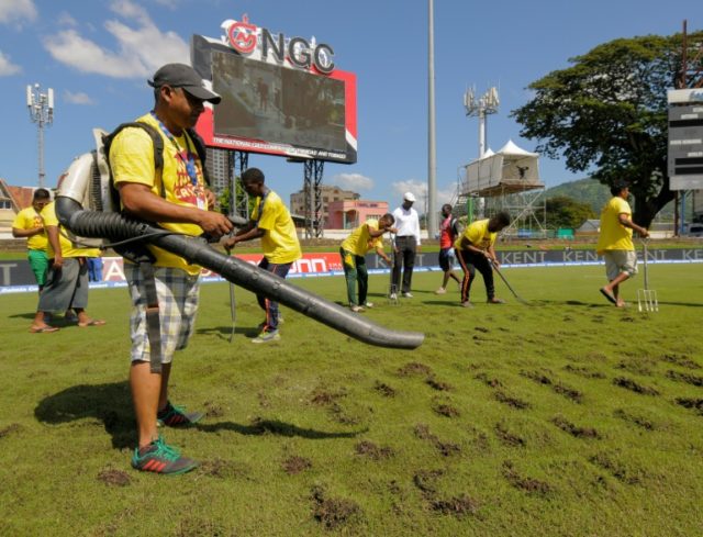 Ground staff use a blower to dry the field during day 3 of the 4th and final Test between