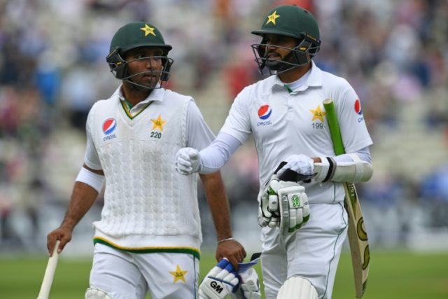 Pakistan batsmen Azhar Ali (right) and Sami Aslam walk off at tea on the second day of the
