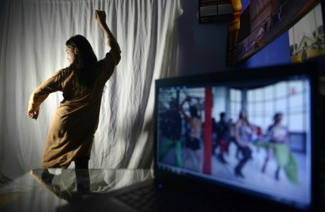 An aspiring Pakistani dancer practices her Bollywood dance moves at a studio in Lahore