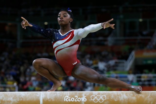 US gymnast Simone Biles competes in the Beam event during the women's team final Artistic