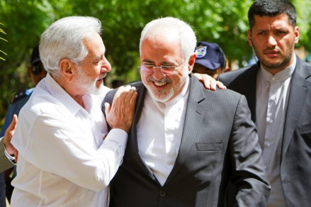 Iran's chancellor Mohammad Javad Zarif (C) is welcomed by the Nicaraguan Foreign Affairs M