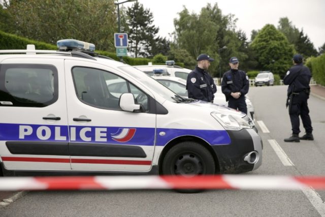 Police cordon off a street in Magnanville, northern France after a man claiming allegiance