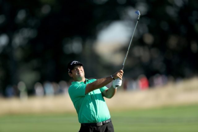 Patrick Reed of the United States plays his second shot on the 11th hole on August 25, 201