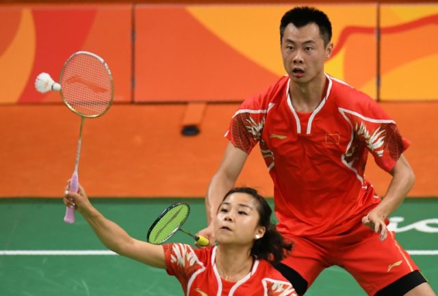 China's Xu Chen (R) and Ma Jin were beaten by Malaysian pair Chan Peng Soon and Goh Liu Yi