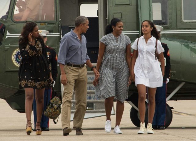 US President Barack Obama, First Lady Michelle Obama and daughters Malia and Sasha walk to