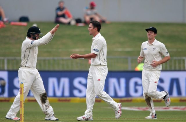 New Zealand bowler Trent Bout (C) celebrates the dismissal of South African batsman Stephe