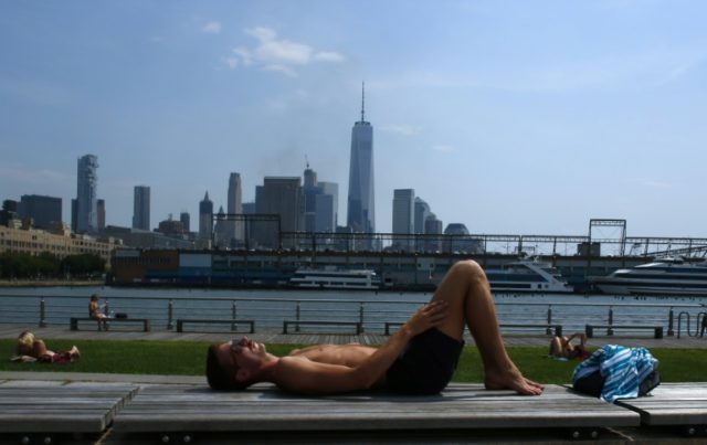 A man sunbathes in New York City during a heat wave in late July 2016
