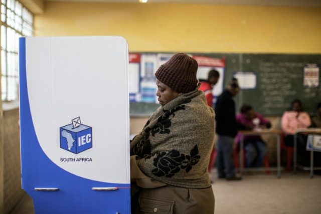 A South African woman casts her vote in the municipal elections in Alexandra township, Joh