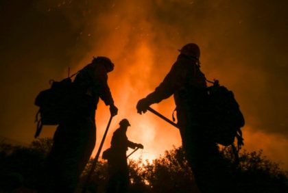 Firefighters battle the Blue Cut wildfire near Cajon Pass, north of San Bernardino, Califo