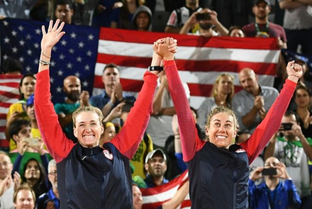 USA's bronze medallists, April Ross (R) and Kerri Walsh Jennings, celebrate on the podium