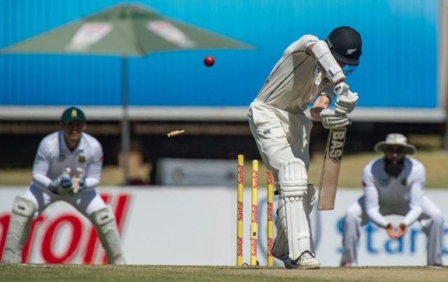 New Zealand batsman Mitchell Santner (C) is bowled by South Africa's Vernon Philander (uns