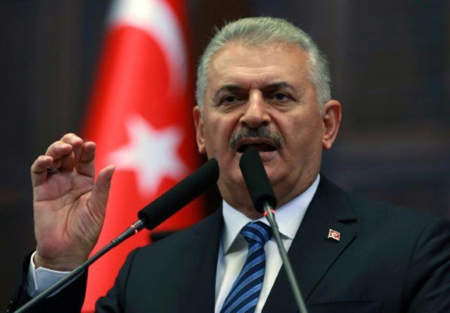 Turkish Prime Minister Binali Yildirim speaks during a meeting of his Turkish ruling Justi