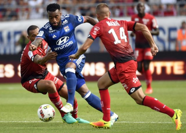 Lyon's French forward Alexandre Lacazette (C), pictured on August 27, 2016, put his team u