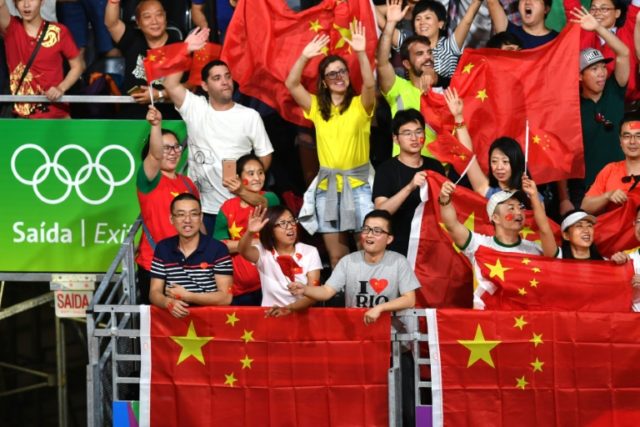 China supporters watch as Denmark's Viktor Axelsen plays Lin Dan in the badminton men's si